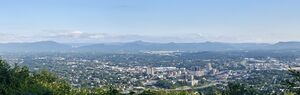 A panorama of Roanoke from the Mill Mountain Star overlook with the Blue Ridge Mountains in the background.
