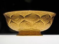 Tang era gilt-gold bowl with lotus and animal motifs
