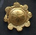 One of 54 identical gold plaques