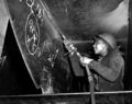 Eastine Cowner, a former waitress, at work on the Liberty ship إس‌إس George Washington Carver at the Kaiser shipyards, Richmond, California, in 1943.