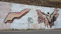 Modern street art of Icaria island and falling Icarus just outside the village of Evdilos on Icaria, Greece