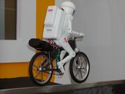 Murata Boy, a 50 cm (20") high bicycle-riding robot developed by the company since 1991 (2005 Model pictured).[19][20][21]