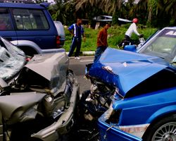 The front ends of two cars after colliding