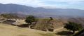 Unrestored section of Monte Albán with مدينة واهاكا في الخلفية