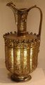 Seljuq era art: Ewer from Iran, dated 1180–1210. Brass worked in repousse and inlaid with silver and bitumen. NY Metropolitan Museum.
