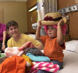 Trying out hats to wear after chemotherapy - cropped.jpg
