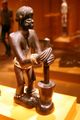 Sculpture representing a female figure. Chokwe peoples, Angola, early 20th century. Wood, brass tacks, glass beads, plant fiber, oil patina.