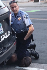 George Floyd neck knelt on by police officer.png