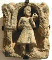 Kushan devotee in the traditional costume with tunic and boots, 2nd century, Gandhara.