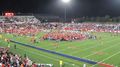 Students on the fields after homecoming win