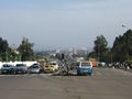 A street in Addis Ababa, with the city skyline in the background