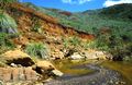 A creek rich in metal oxides in the south of Grande Terre.