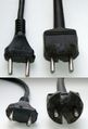 Moulded rubber Soviet plugs cut with knife so that they can fit into CEE 7/3 socket. Originally the plugs had a round base.