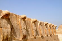 Frieze of sculpted uraei, or rearing cobras, atop a wall at the pyramid complex of Djoser. Twenty-eighth century BC.