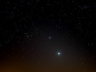 The bright Venus in the cone of the zodiacal light 8 degrees above the western horizon on 23 March 2020. This was eleven days before Venus approached the Golden Gate of the Ecliptic (centre) between the Pleiades (right) and the Hyades together with Aldebaran (left) in the constellation Taurus (centre).