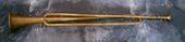 Slide trumpet replica. When trumpets only had a narrow range of playable notes, the slide trumpet allowed that range to increase. The tube that slides is where the mouthpiece enters; pulling it in and out changes the length of the trumpet, changing its key.