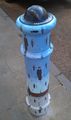 Bollard in the style of Golconda by René Magritte