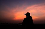 A Bahraini man points skyward at dusk Tuesday, Aug. 10, 2010, in Hamad Town, Bahrain, towards where a slim crescent moon should be visible to indicate the start of the Islamic holy month of Ramadan, a time of prayer, fasting and charitable giving. Clouds hampered skywatchers in the Persian Gulf island nation. (AP Photo/Hasan Jamali)