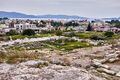 Ruins of the Telesterion at the Sanctuary of Demeter in Eleusis with view to the modern town