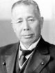 Giichi Tanaka posing cropped.jpg