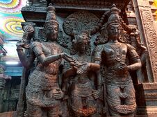 Vishnu gives away his sister, the bride Parvati during her wedding to Shiva