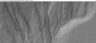 Close-up of small channels in gullies in Arkhangelsky Crater, as seen by HiRISE under HiWish program Patterned ground in the shape of polygons can be seen to the right. Note: this is an enlargement of the previous image from Arkhangelsky Crater.