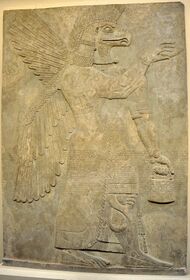 Wall relief depicting an eagle-headed and winged man, Apkallu, from Nimrud.