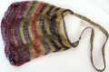 A bilum bag, used in Papua New Guinea. Bilums are made of "bush rope", cuscus fur or wool, and expand in size.