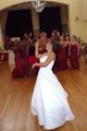 A new bride tossing her باقة أزهار over her shoulder.