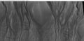 Close-up of channels in gullies showing that the paths of the channels changed over time. This feature suggest formation by running water with a high load of sediment. Picture was taken with HiRISE under HiWish program. Location is the Mare Acidalium quadrangle. Note this is an enlargement of a previous image in Phaethontis quadrangle.