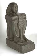 Basalt sculpture of Harsomtus em hat from th twenty-sixth Dynasty of Egypt.