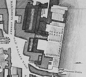 The Old Palace of Westminster was a complex of buildings, separated from the River Thames in the east by a series of gardens. The largest and northernmost building is Westminster Hall, which lies parallel to the river. Several buildings adjoin it on the east side, south of those and perpendicular to the Hall is the mediaeval House of Commons, further south and parallel to the river is the Court of Requests, with an eastwards extension at its south end, and at the south end of the complex lie the House of Lords and another chamber. The Palace was bounded by St Margaret's Street to the west and Old Palace Yard to the south-west; another street, New Palace Yard, is just visible to the north.