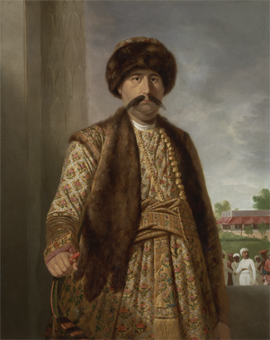 A color portrait of a burly mustached man wearing a turban and royal dress