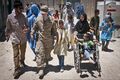 U.S. Army Spc. Helen Jeschow, second from left, an information support operations specialist with the 340th Tactical Military Information Support Operations Company, Task Force Tsunami, speaks with an 120603-A-ZU930-009.jpg