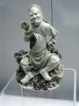 Blue underglaze statue of a man with his pipe, from Jingdezhen, Ming Dynasty (1368-1644 AD)