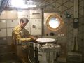 An astronaut dines aboard the backup Skylab at the Smithsonian NASM.