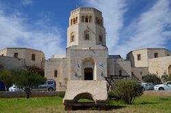 Photo of the Latin inscription set against the Rockefeller Museum, seat of the Israel Antiquities Authority in Jerusalem (15714219522).jpg