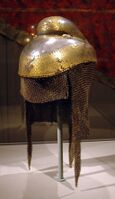 Sikh warrior helmet with butted mail neckguard, 1820–1840, iron overlaid with gold with mail neckguard of iron and brass