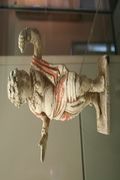A Chinese Tang Dynasty (618-907) terracotta statuette of a foreign male dancer from the west (India?), with traces of polychrome