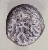 Terracotta stamp seal with Master of Animals motif, Tell Telloh, ancient Girsu, End of Ubaid period, c. 4000 BC [17][18]
