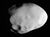 An oblong object with a few large craters and a smooth surface