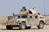US Navy 060322-N-5438H-018 U.S. Army soldiers assigned to the Bravo Battery 3rd Battalion 320th Field Artillery Regiment along with Iraq Army soldiers from the 1st Battalion 1st Brigade 4th Division perform a routine patrol.jpg