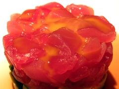 Raw quail egg over raw tuna.jpg