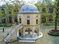 Courtyard of the Koza Han in Bursa, Turkey (1491, Ottoman period) ; the domed building is a small mosque[5]