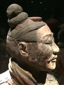 Close-up on an archer's head. Notice the details put into the hair of the archer.