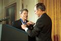 George H. W. Bush awarding former President Ronald Reagan the Presidential Medal of Freedom with Distinction in January 1993