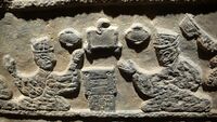 A relief depicting two men gambling