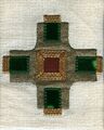 Appliqué cross. The edges are covered and stitches are hidden. It is overlaid with decorative gold thread.