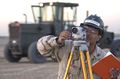 A surveyor uses a theodolite
