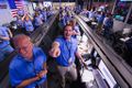 Engineers at NASA's Jet Propulsion Laboratory celebrate the landing.[7]